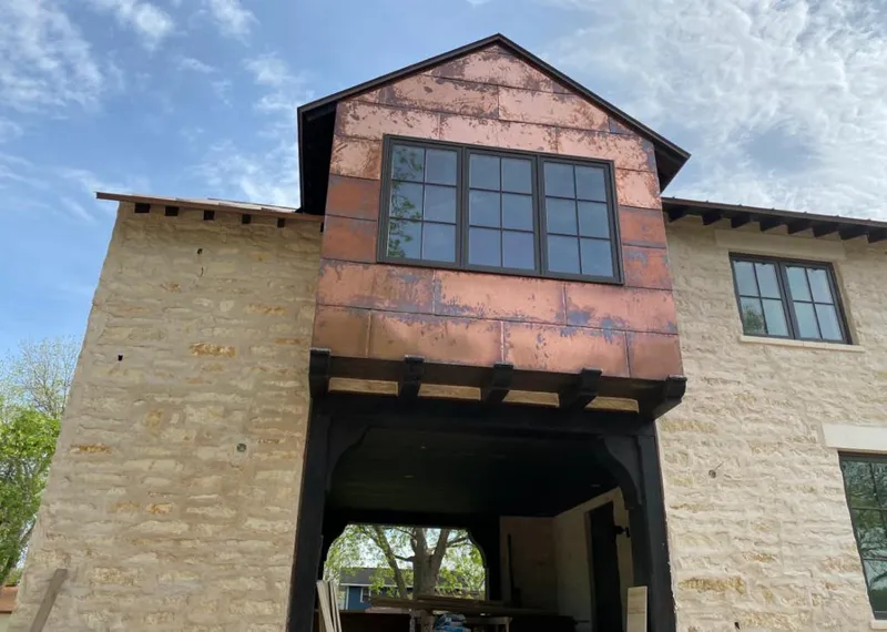 Copper metal panel facade on a stone building for Skylight Installation in Walla Walla
